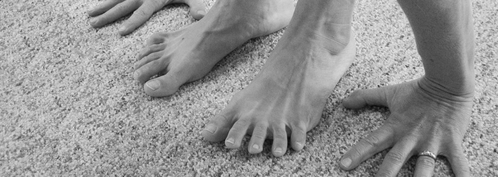 Contact us! image of hands and feet touching the floor.